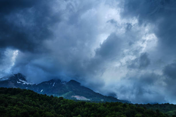 istock Stormy clouds above Caucasus mountains. 1321420372