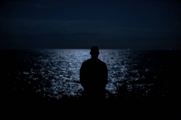 istock Lake reflecting the moonlight of a full moon 1321421664