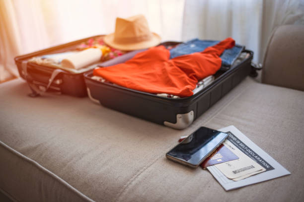 istock Suitcase packing for travel, COVID-19. 1321422432