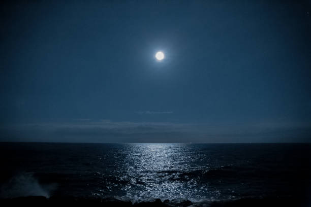 istock Lake reflecting the moonlight of a full moon 1321422586