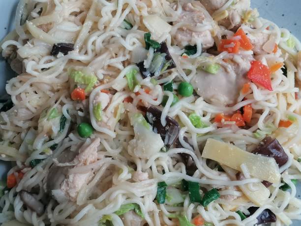 istock Fried noodles with chicken and chinese vegetables 1321425101