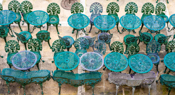 Old-fashioned metal chairs and tables.