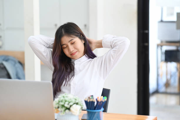 istock Happy woman office worker resting at comfortable office chair. 1321428484