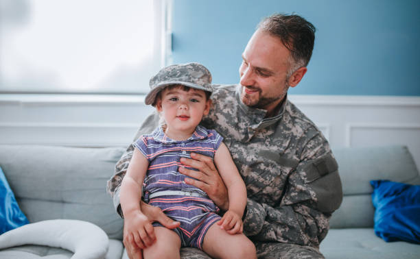 istock Military Dad Hugging His Young Daughter 1321428757