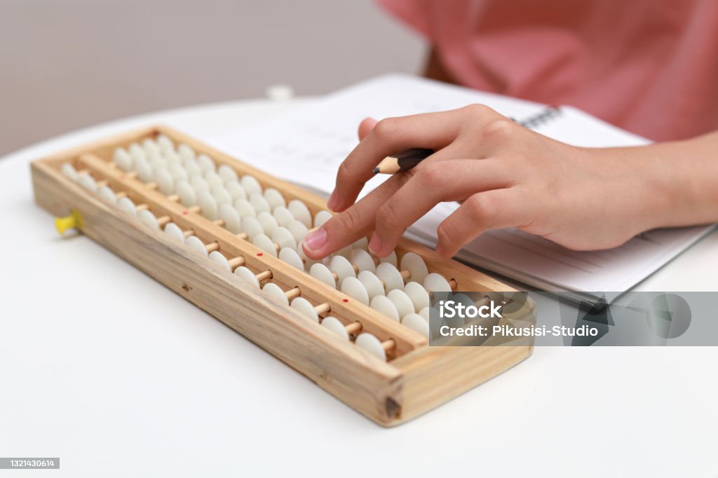 Asian Using Abacus For Math Cropped Image Of An Asian Student Using Abacus Doing Calculation Stock ...