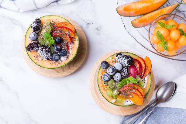 istock Fruit salad with yogurt in carved melon cantaloupe bowl 1321432728