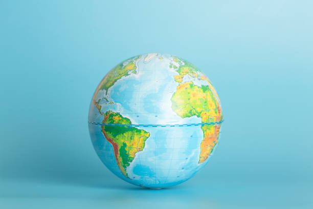 Globe of the Earth on a blue background. Ecology, globalization, environment concept. Globe of the Earth on a blue background. Ecology, globalization, environment concept. High quality photo equator stock pictures, royalty-free photos & images