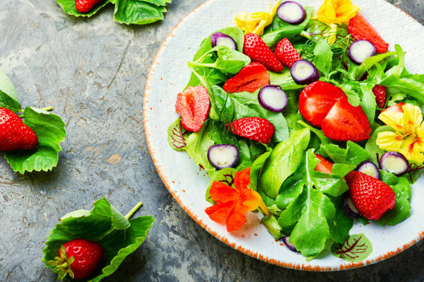 istock Summer salad with berries and herbs 1321432914
