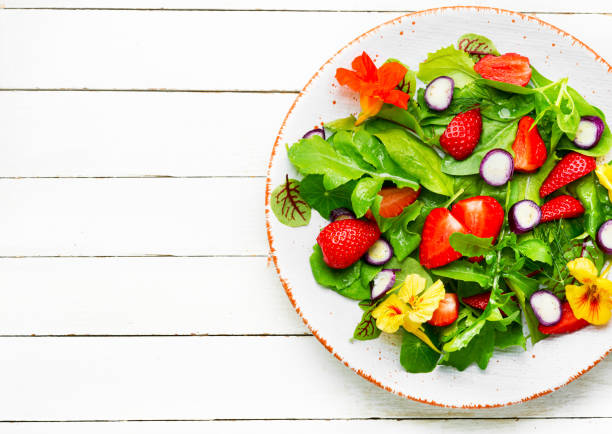 istock Summer salad with berries and herbs 1321432916