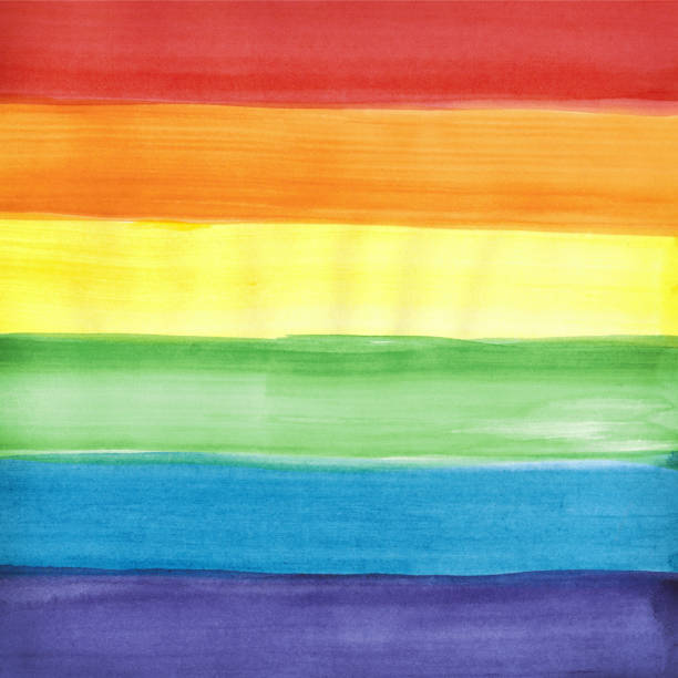 istock Rainbow colored LGBT pride flag.  Watercolor painted background with copy space for design. 1321434035