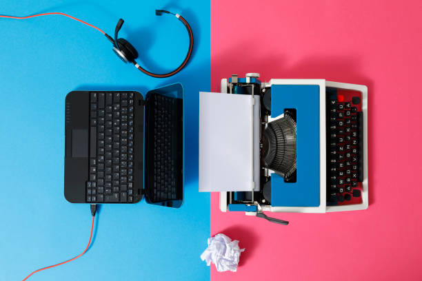 istock Digital und analog – Laptop and 80s Typewriter 1321434957