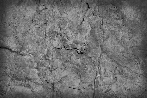 istock Gray cracked texture of stone patterns abstract background 1321435060