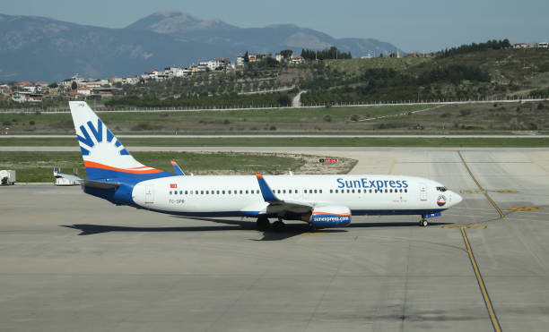 Sun Express Boeing 737 IZMIR, TURKEY - APRIL 11, 2021: Sun Express Boeing 737-86Q (CN 30272) taxiing in Adnan Menderes Airport sunexpress stock pictures, royalty-free photos & images