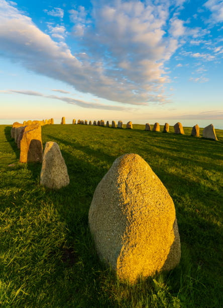 Ale Stones (Ales stenar) Is a megalithic monument of 59 large boulders and is 67 meters long. This landmark is located in Kåseberga, Sweden Ale Stones (Ales stenar) Is a megalithic monument of 59 large boulders and is 67 meters long. This landmark is located in Kåseberga, Sweden. ales stenar stock pictures, royalty-free photos & images