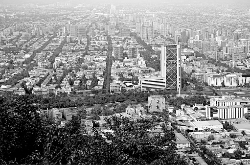 Monochrome aerial view of Santiago cityscape as seen from San Cristobal hill in Santiago, Chile, South America