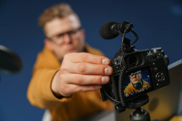 istock A blogger in his recording studio adjusts a camera 1321443336