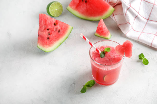 istock Fresh tasty watermelon smoothie in glass on white background. 1321448015