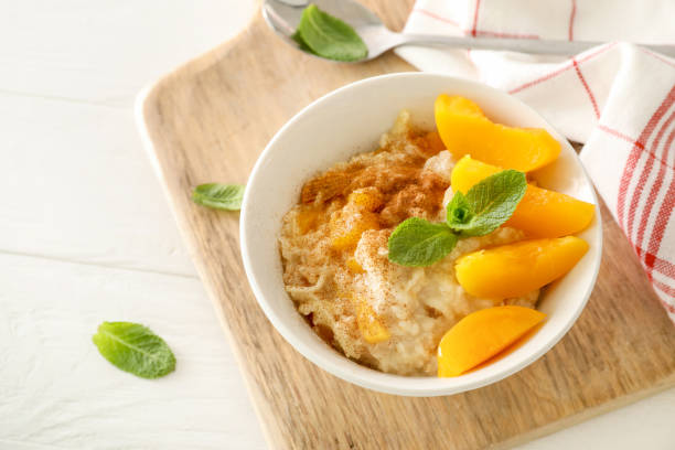 istock Breakfast oatmeal with peaches, cinnamon and almonds 1321448370