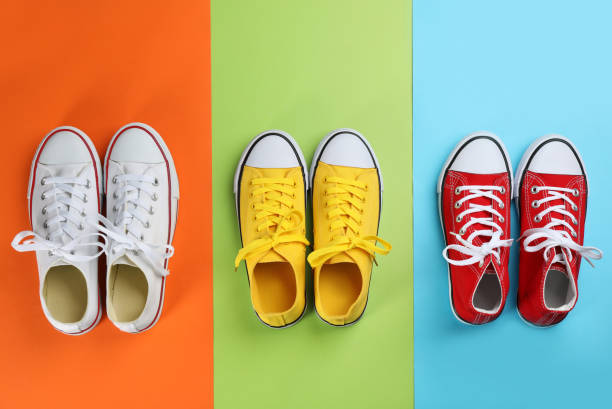 istock Stylish sneakers on color background, flat lay 1321451854
