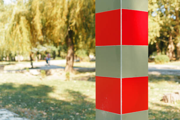 red white metal poles for barrier on a road