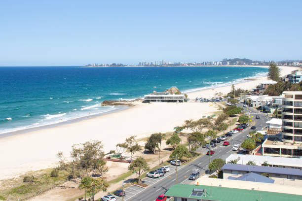 istock Overhead views of the white sandy beach and blue pacific ocean and trees 1321452491