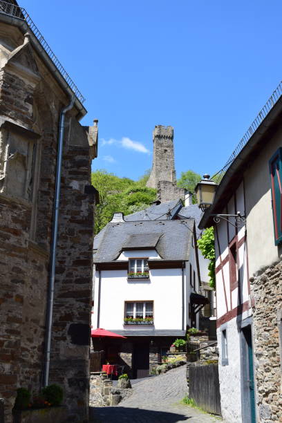istock old town street with a view to a tower ruin 1321452495