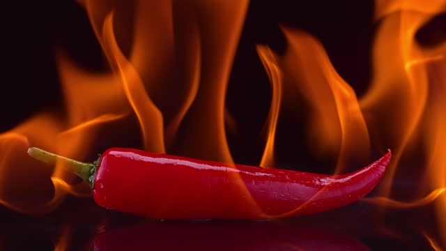 SLO MO LD Red hot pepper on fire