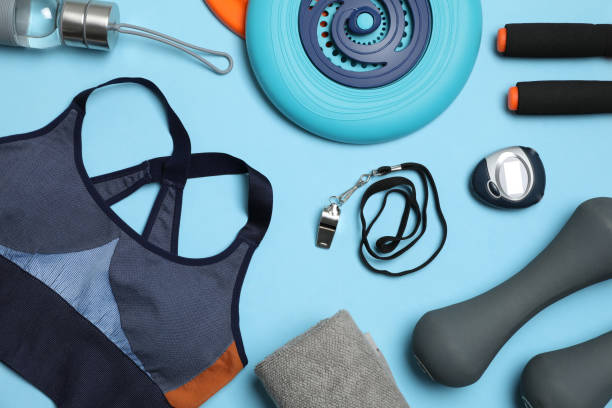 istock Flat lay composition with sports equipment on light blue background 1321453726