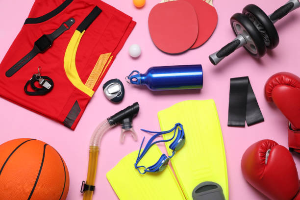 istock Flat lay composition with sports equipment on pink background 1321453740