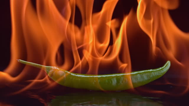 SLO MO LD Green chilli pepper burning