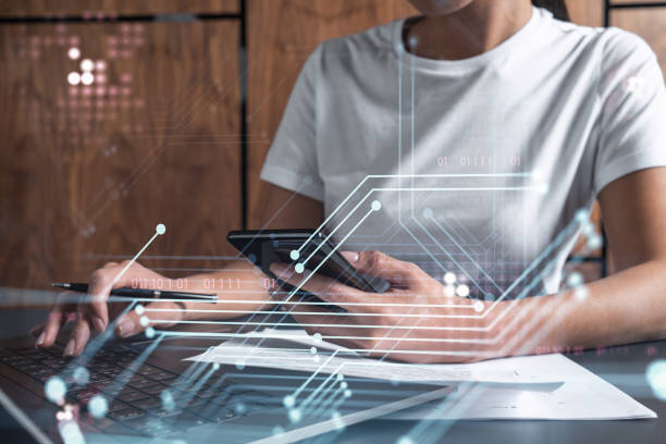 istock Woman hands typing the keyboard to create innovative software to change the world and provide a completely new service. Close up shot. Hologram tech graphs. Concept of Dev team. Casual wear. 1321454662