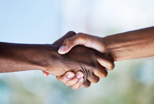 istock Closeup shot of two unrecognisable men shaking hands 1321457171