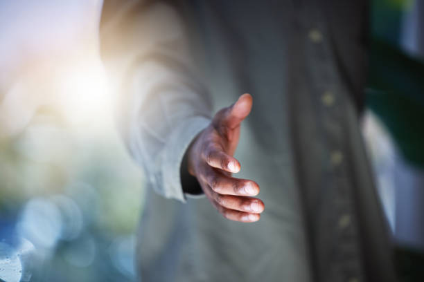 istock Closeup shot of an unrecognisable man extending a handshake 1321457178