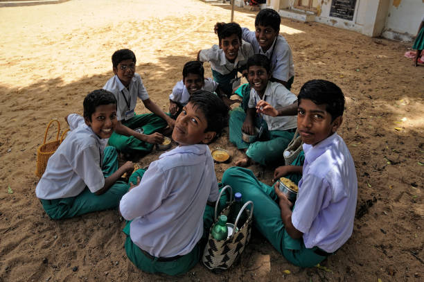 South Indian students eating lunch box in lunch break at Thanjavur state Tamil Nadu India