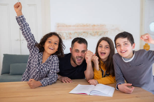istock Bearded dad and children happy that they completing tasks 1321458853