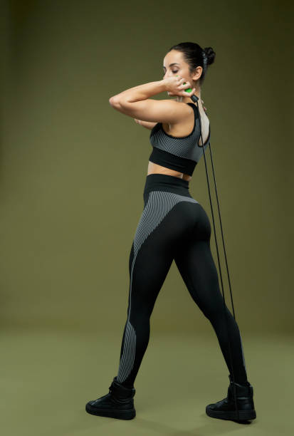 istock Athletic young woman doing exercise with jump rope 1321459942