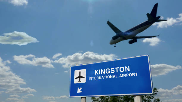 istock Plane landing in Kingston Jamaica airport with signboard 1321460607
