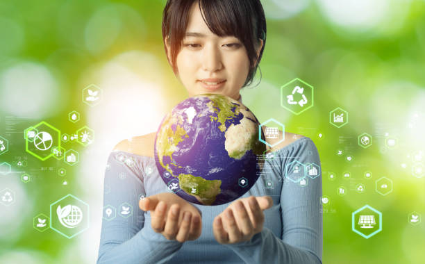 istock Young asian girl watching the earth. Environmental protection  concept. Sustainable development goals. SDGs. 1321461639