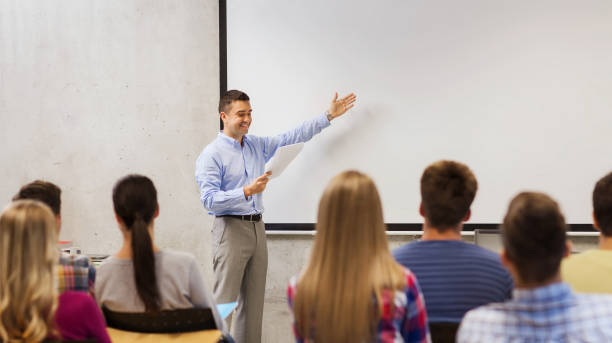 istock group of students and smiling teacher with notepad 1321464176