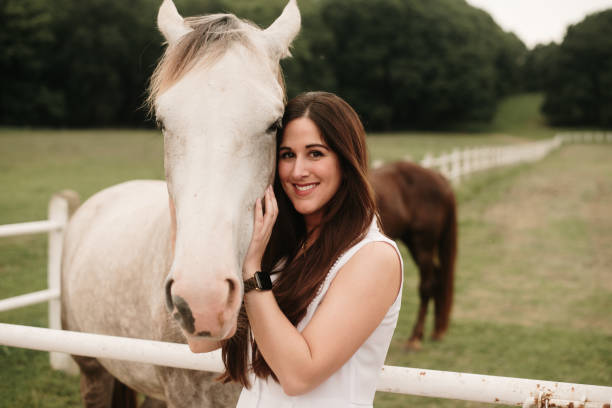 istock Young woman with horse 1321464370