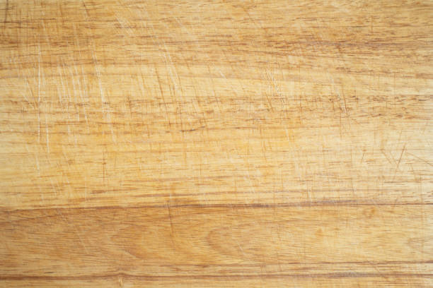 istock A used wooden kitchen cutting board background 1321464413