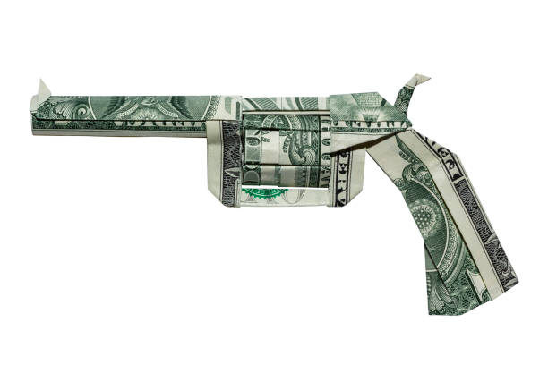 geld origami revolver gun gefaltet mit 3 echten ein dollar bills isoliert auf weißem hintergrund - guns and money stock-fotos und bilder