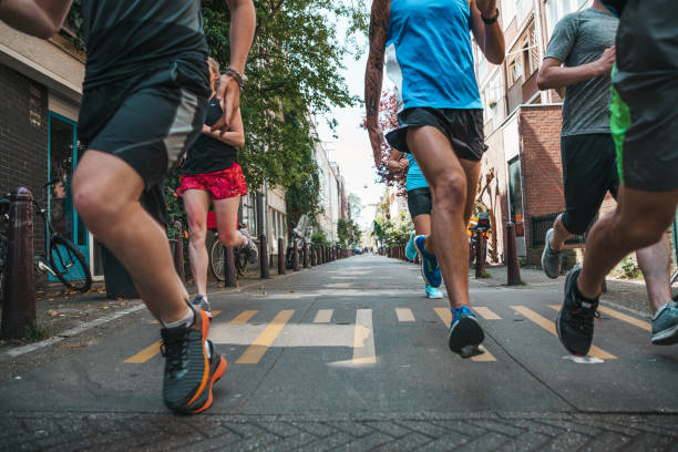istock Group of runners training in the city streets 1321464775