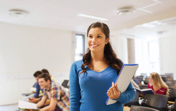 istock group of smiling students in lecture hall 1321464808