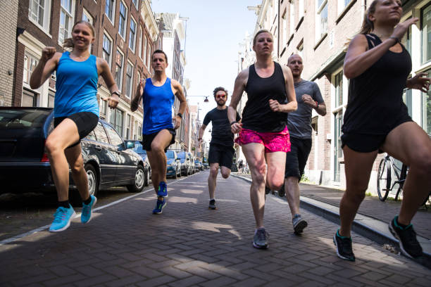 istock Group of runners training in the city streets 1321464981