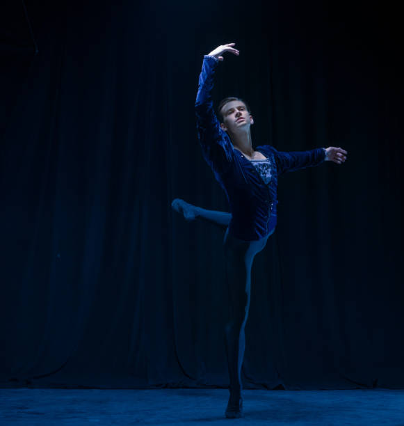 istock Young and graceful ballet dancer isolated on dark background in neon light. Art, action, inspiration concept. 1321467977