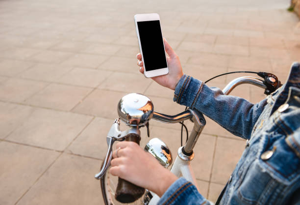 istock Cropped image of young lady outdoors using mobile phone. 1321469285