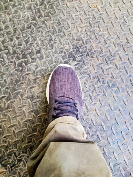 istock one foot using a shoe on an iron floor photo 1321471079