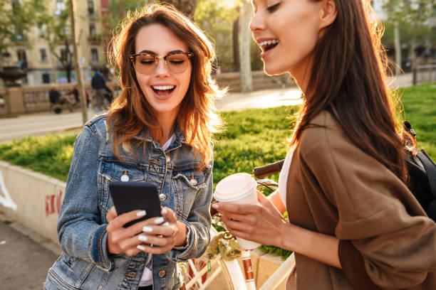 istock Beautiful women friends outdoors with bicycles 1321471859