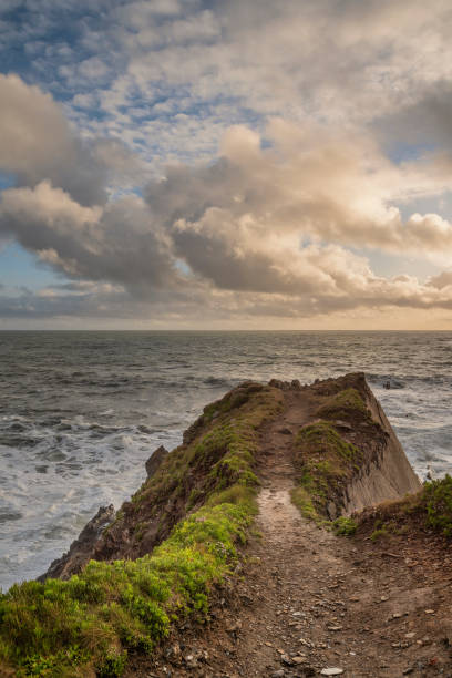 istock Stunning landscape image of view from Hartland Quay in Devon England durinbg moody Spring sunset 1321472009